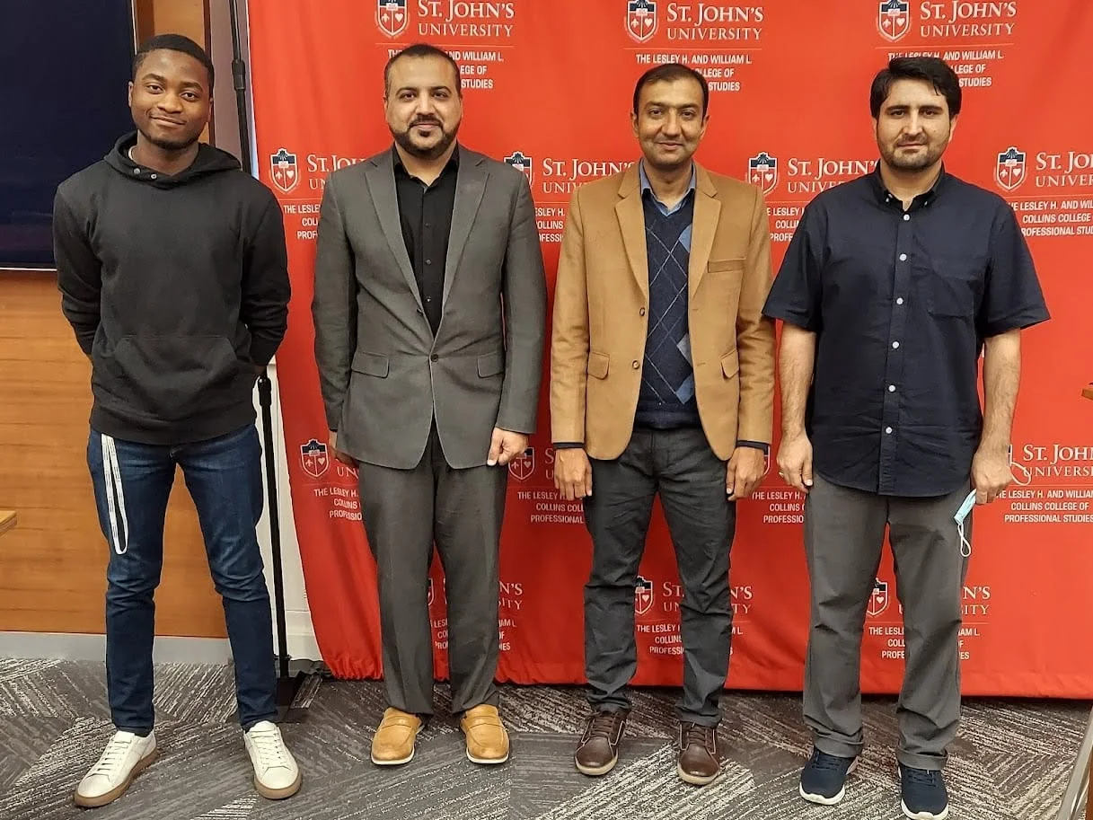 Dr. Bukhari with colleagues at St. John’s University