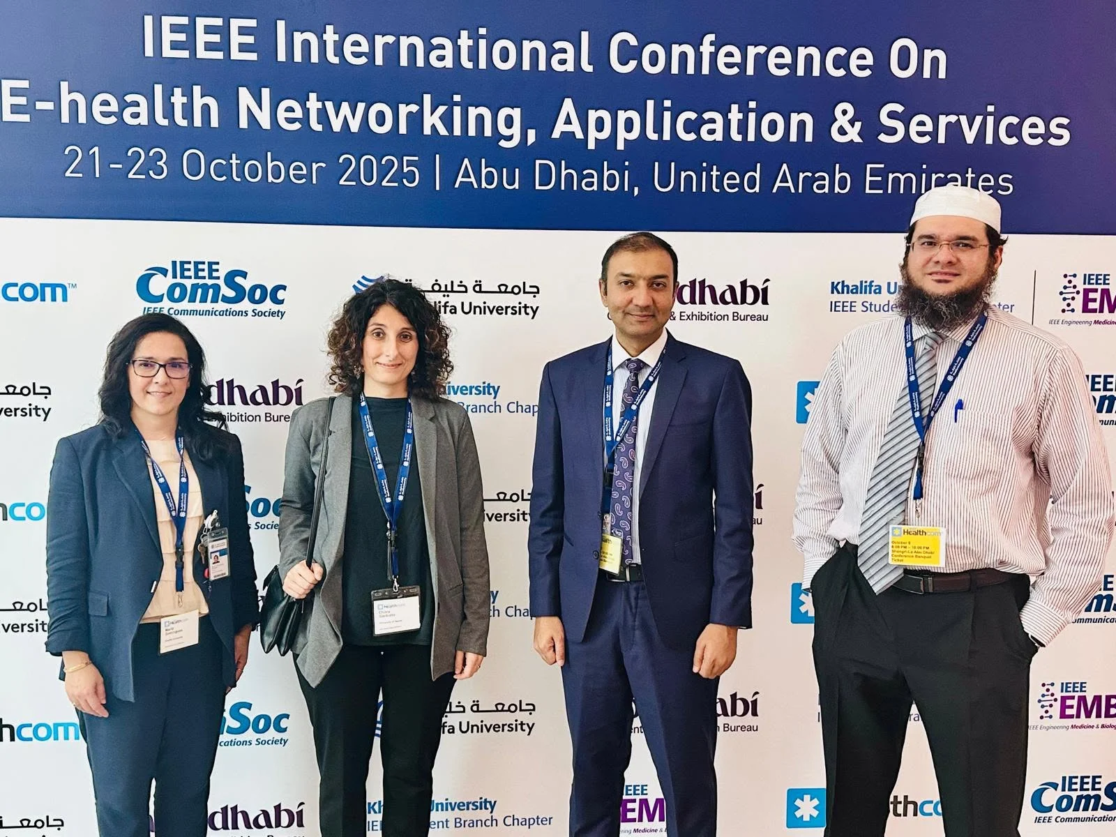 Dr. Bukhari with colleagues at an IEEE healthcare conference