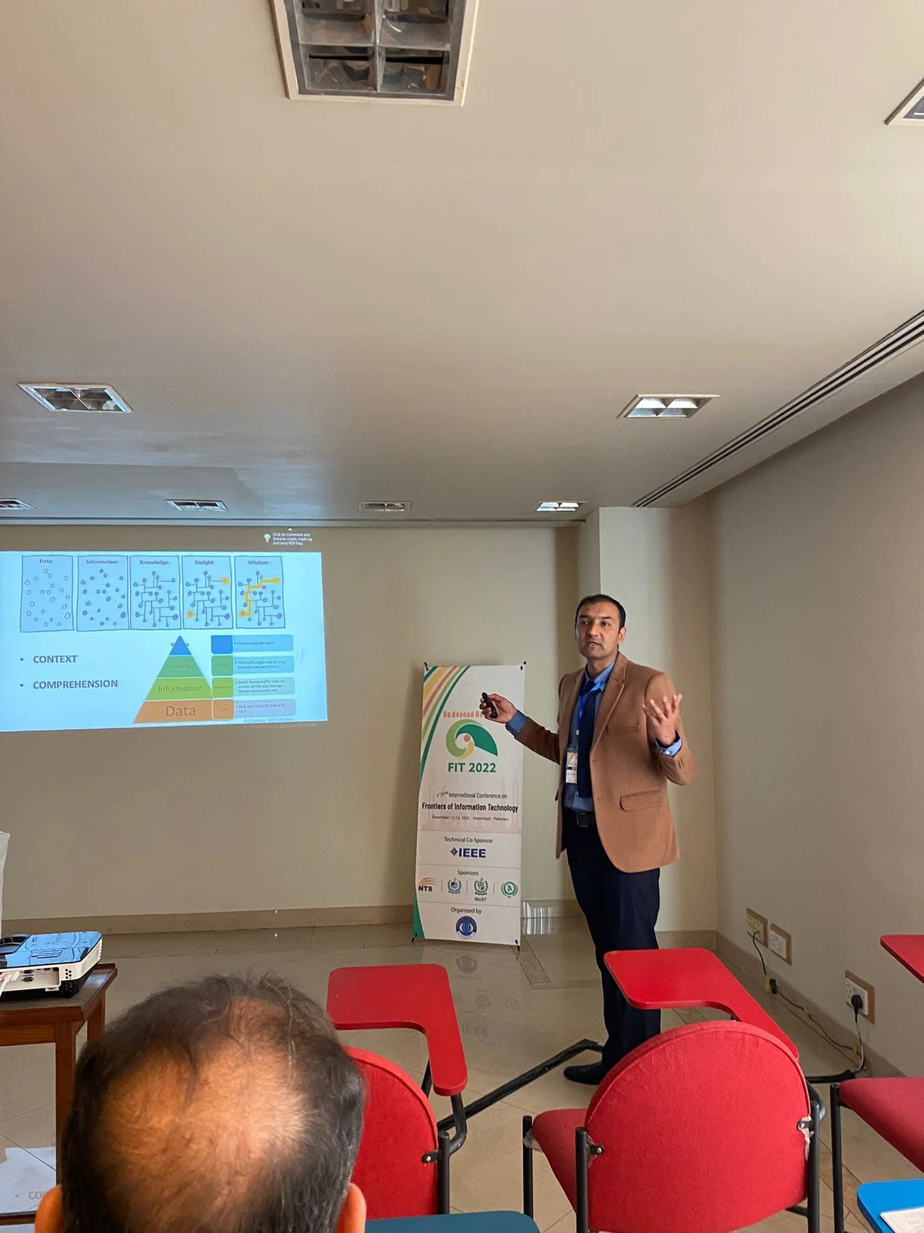 Dr. Bukhari delivering a conference presentation